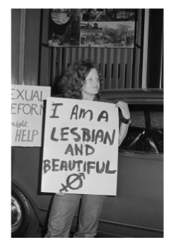 Mim Loftus with a placard ‘I am a lesbian and beautiful’, Sydney, 8 Oct 1971, Phillip Potter Collection (Photo: Phillip Potter)